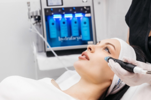 Cosmetology clinic. Professional female cosmetologist doing hydrafacial toronto